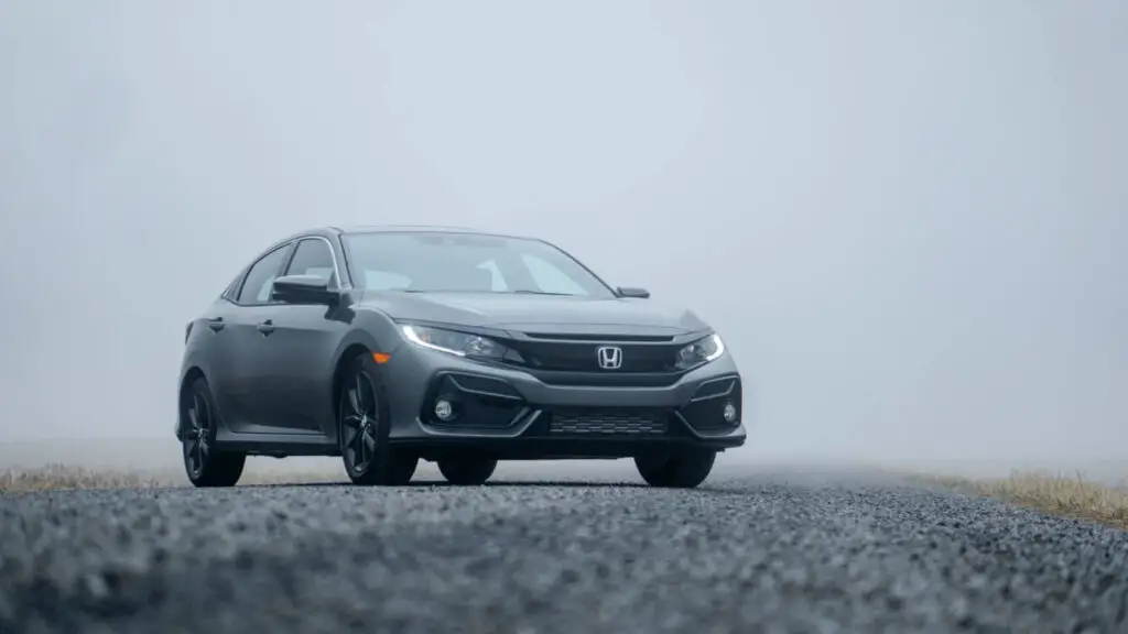Gray Honda on an asphalted road